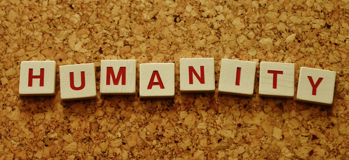 Word Written with Scrabble Pieces on Wooden Background